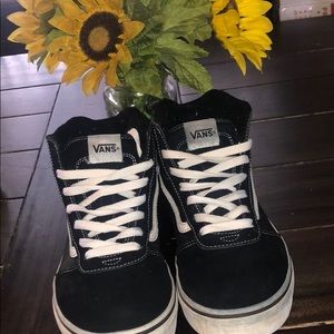Black and white high top vans